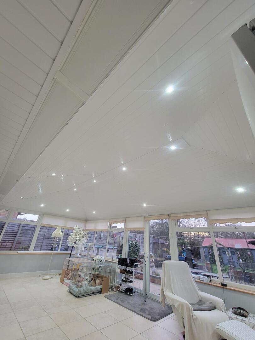 Edwardian conservatory interior after transformation — bright room with fitted spotlights